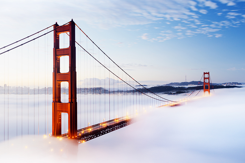 Golden Gate bridge in San Francisco, shrouded in morning mist.